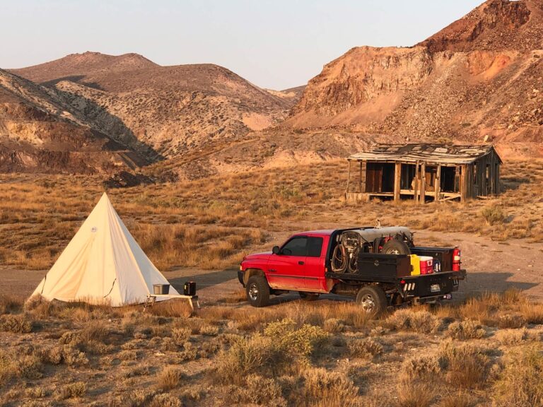 mobile rig welding red truck in field